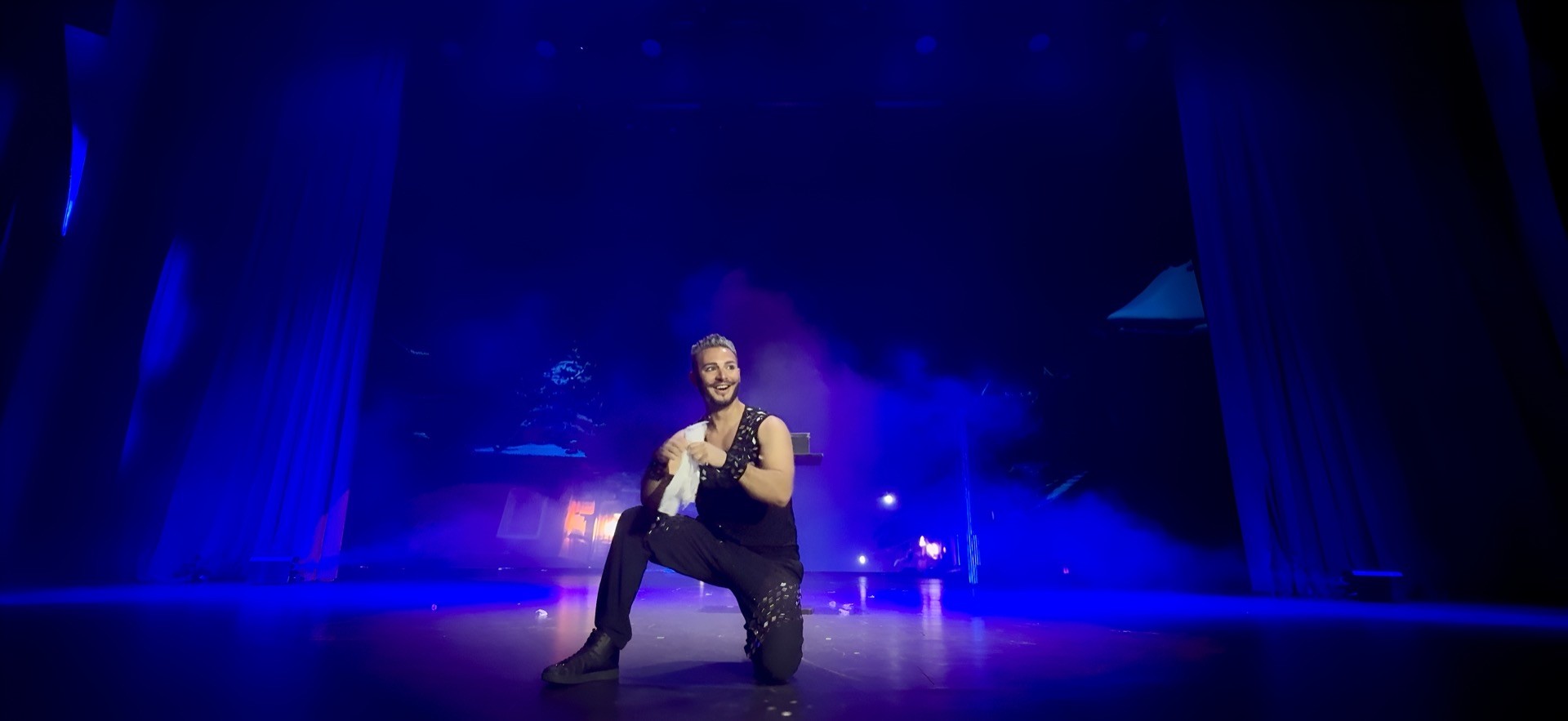 Zee Zeus — wide blue stage production shot
