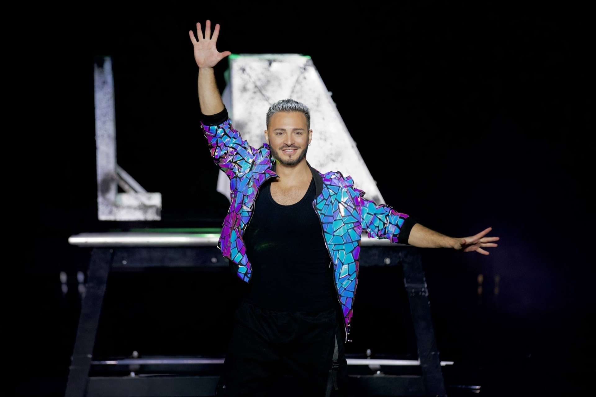 Zee Zeus — mirrored jacket stage pose