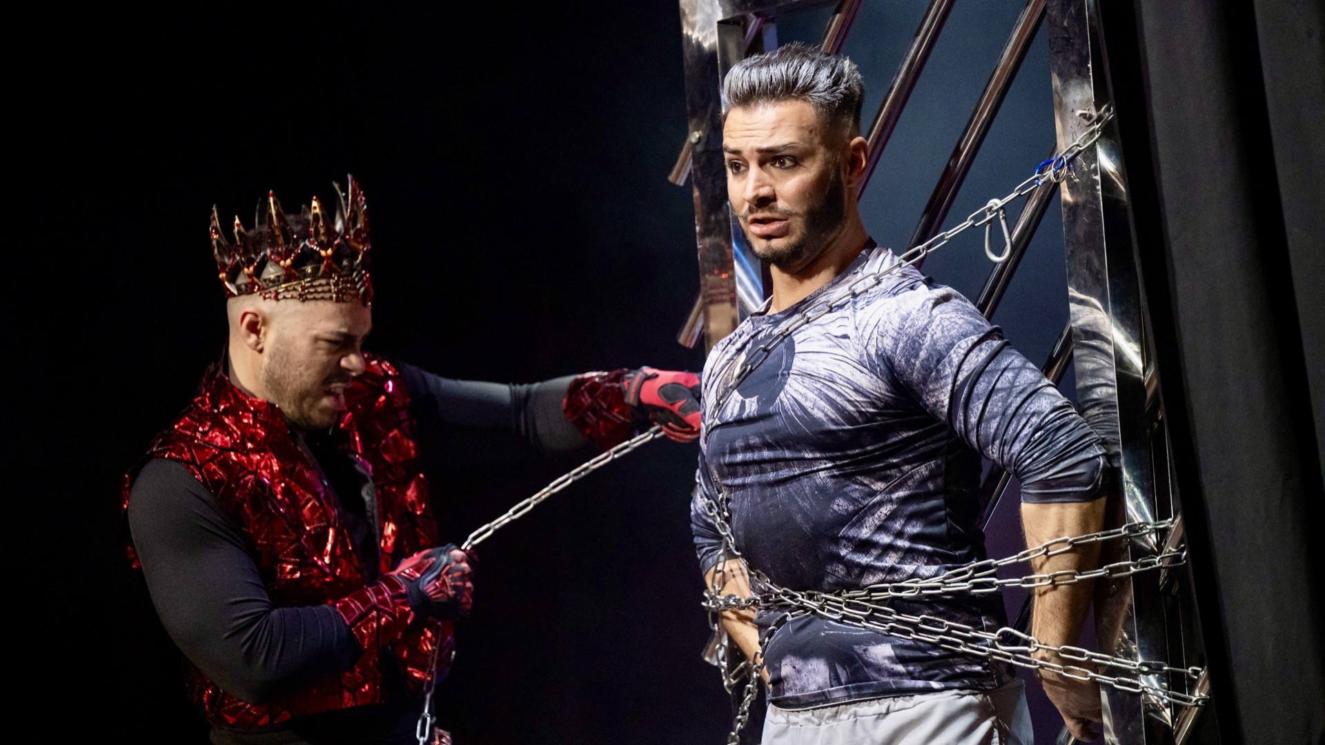 Zee Zeus — chained escape illusion on stage